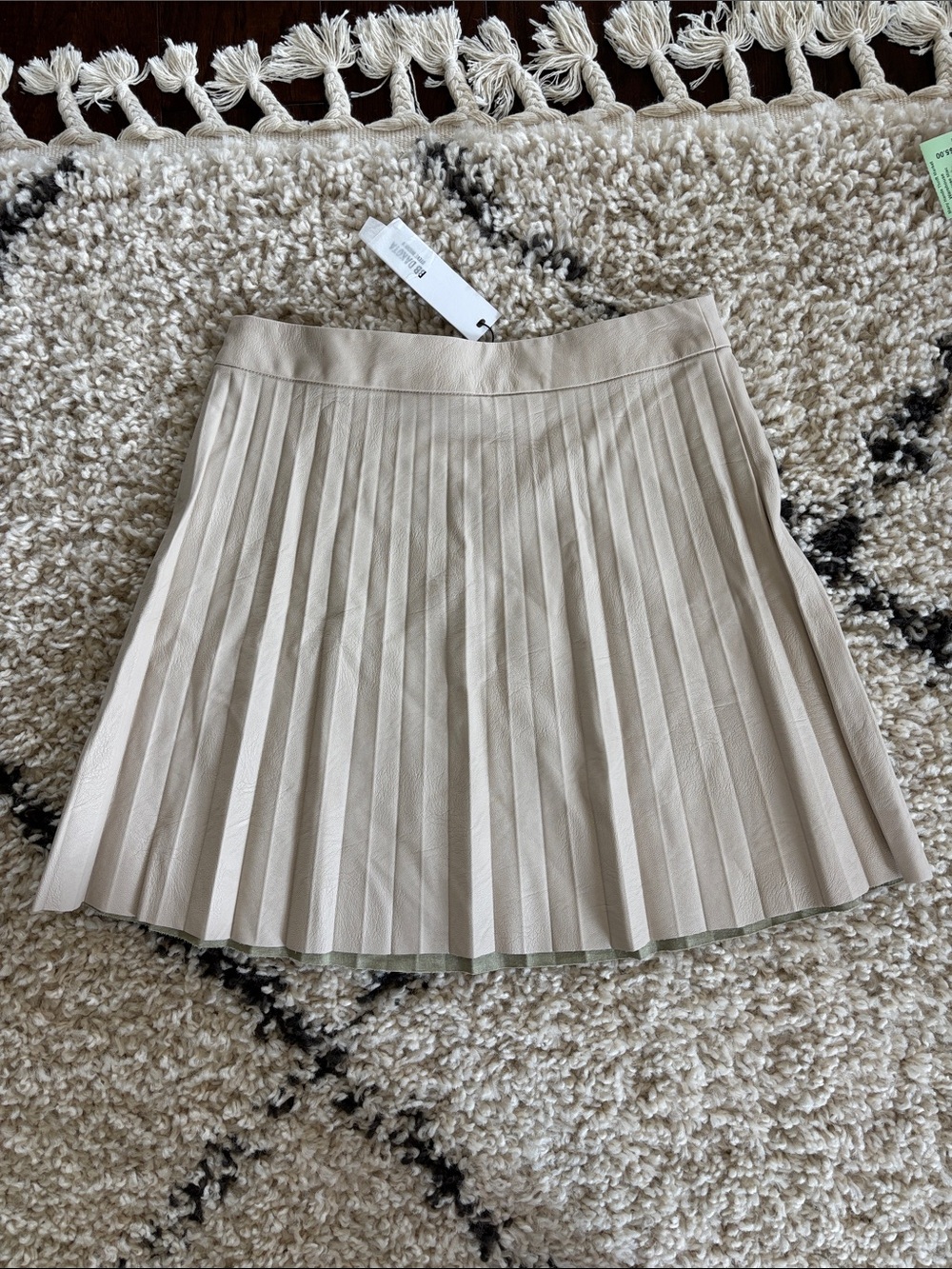 Pleated Faux Leather Mini Skirt in Light Beige